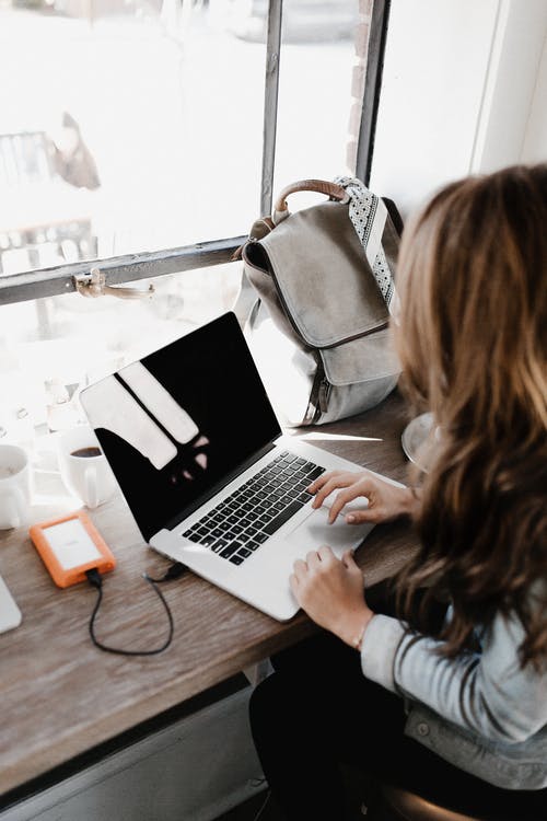 Teen working on laptop